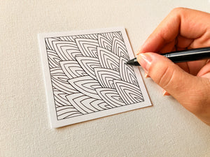 Simple mindful art mandala drawing, hand holding pen
